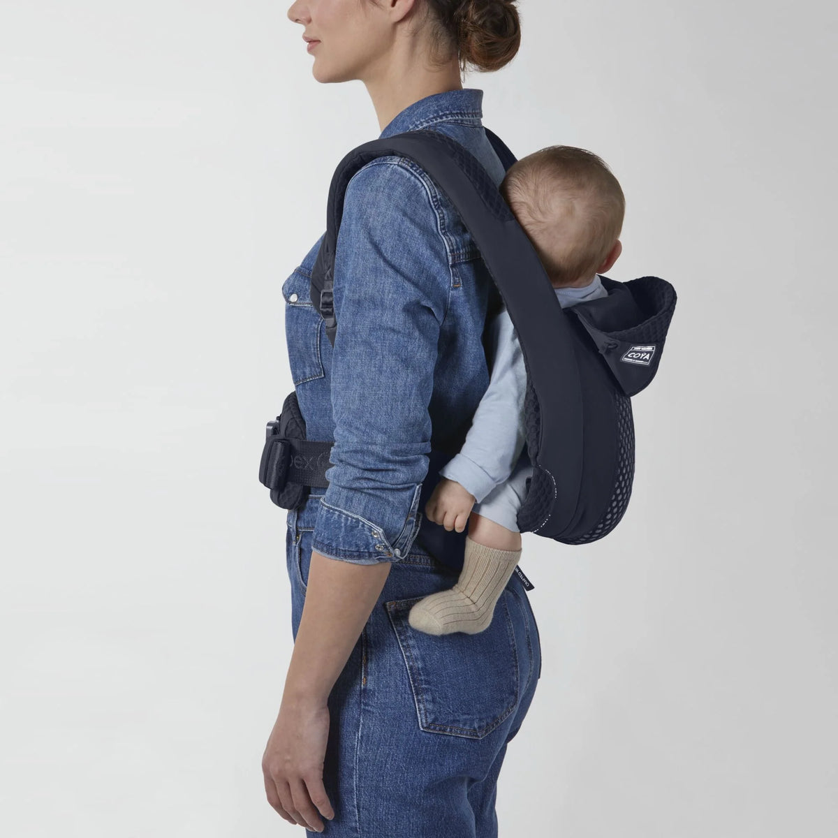 Dark blue baby carrier with padded shoulder straps and head support