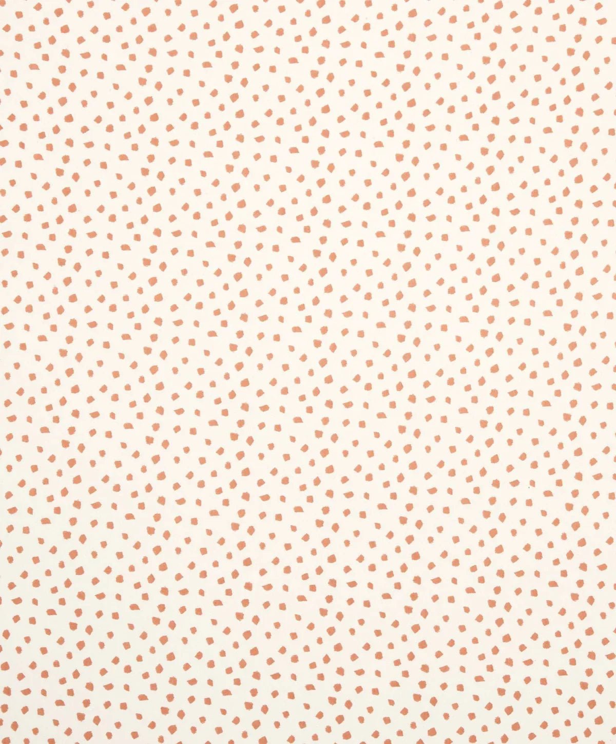 Cotbed fitted sheet fabric with tiny red dot pattern on light cream background