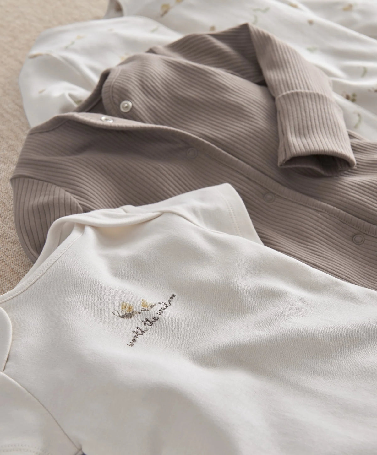 Gray ribbed button-top and white embroidered bodysuit from baby clothing set