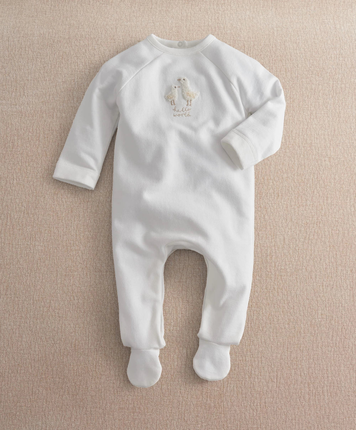 White footed baby all-in-one with long sleeves and duck Hello World embroidery