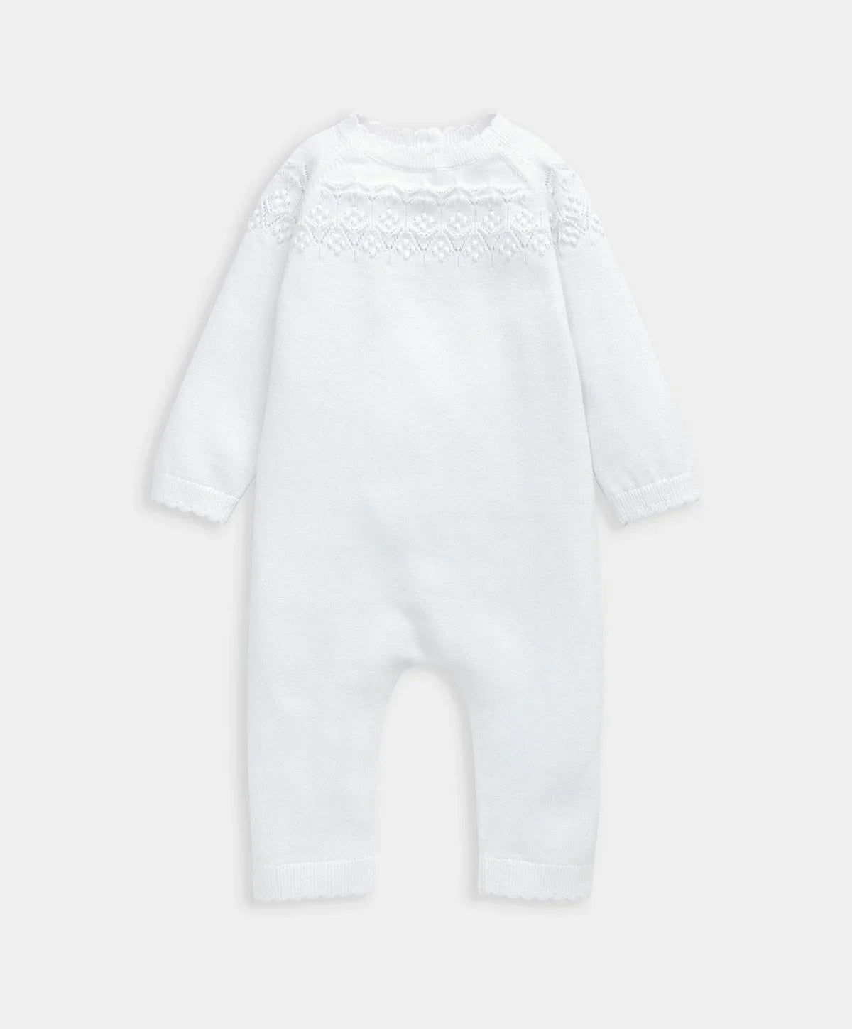 White knitted romper with textured pointelle yoke and long sleeves