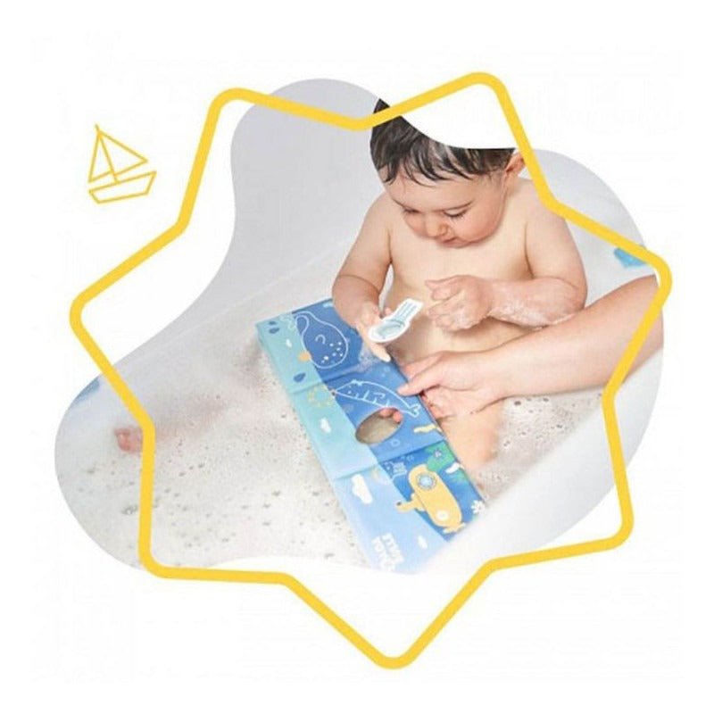 Baby playing with blue bath book featuring sea animal drawings