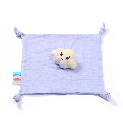 Plush light-blue cloud cuddly toy with smiling face on a tied comforter blanket