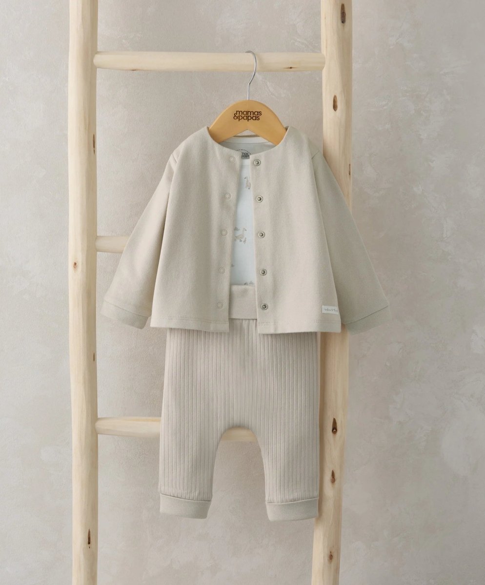 Infant jacket, bodysuit and leggings set in light neutral with button front