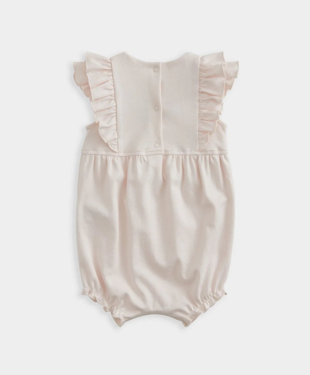 Shortie romper back with ruffled shoulders and button-front placket, pale pink
