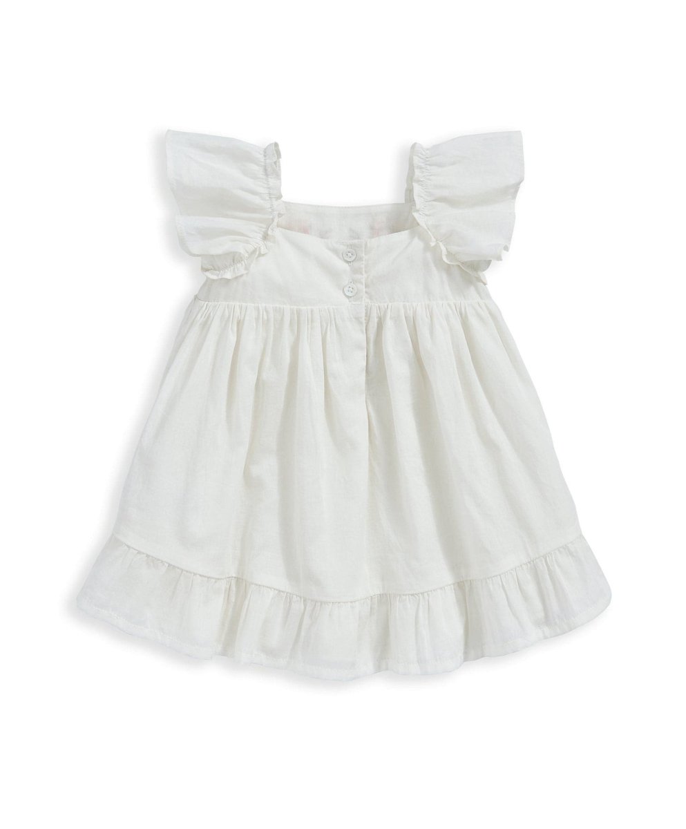 White embroidered dress with puff sleeves and tiered skirt, ruffled neckline