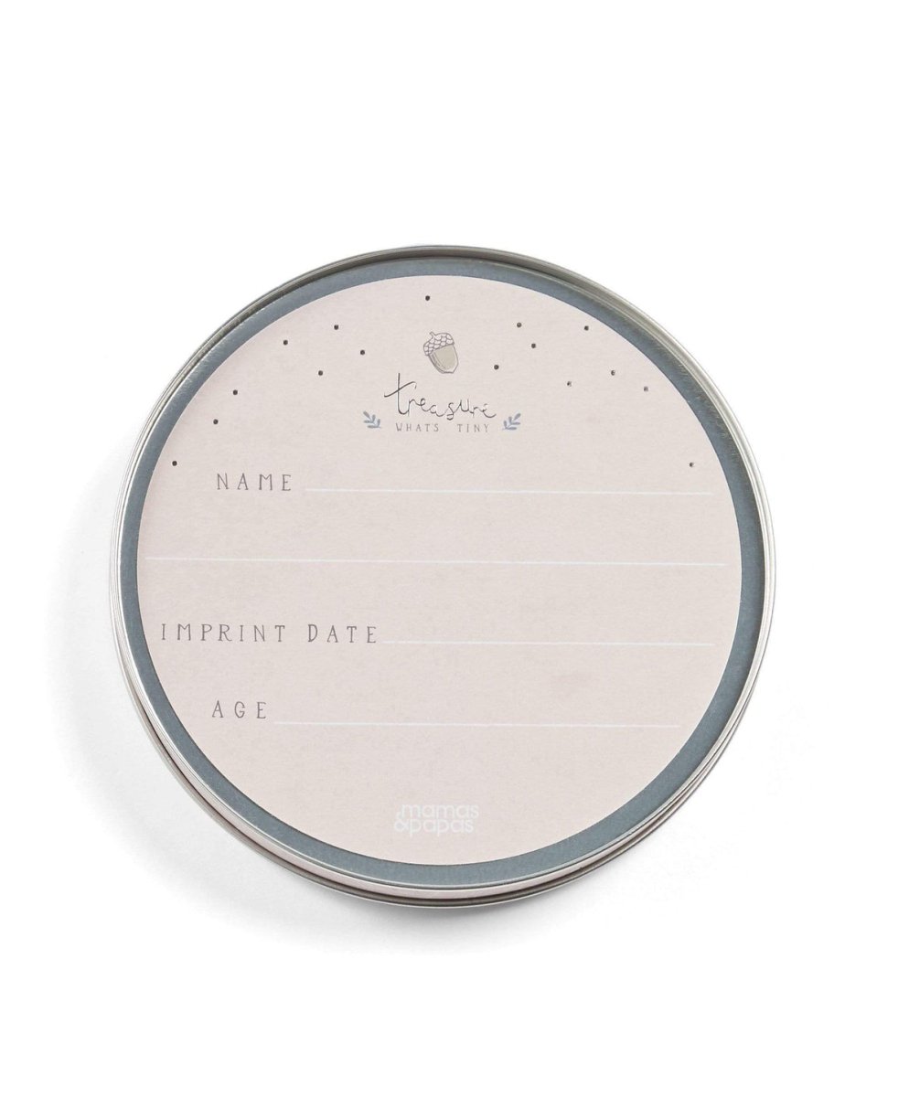 Baby imprint tin lid with fields for name, imprint date, and age