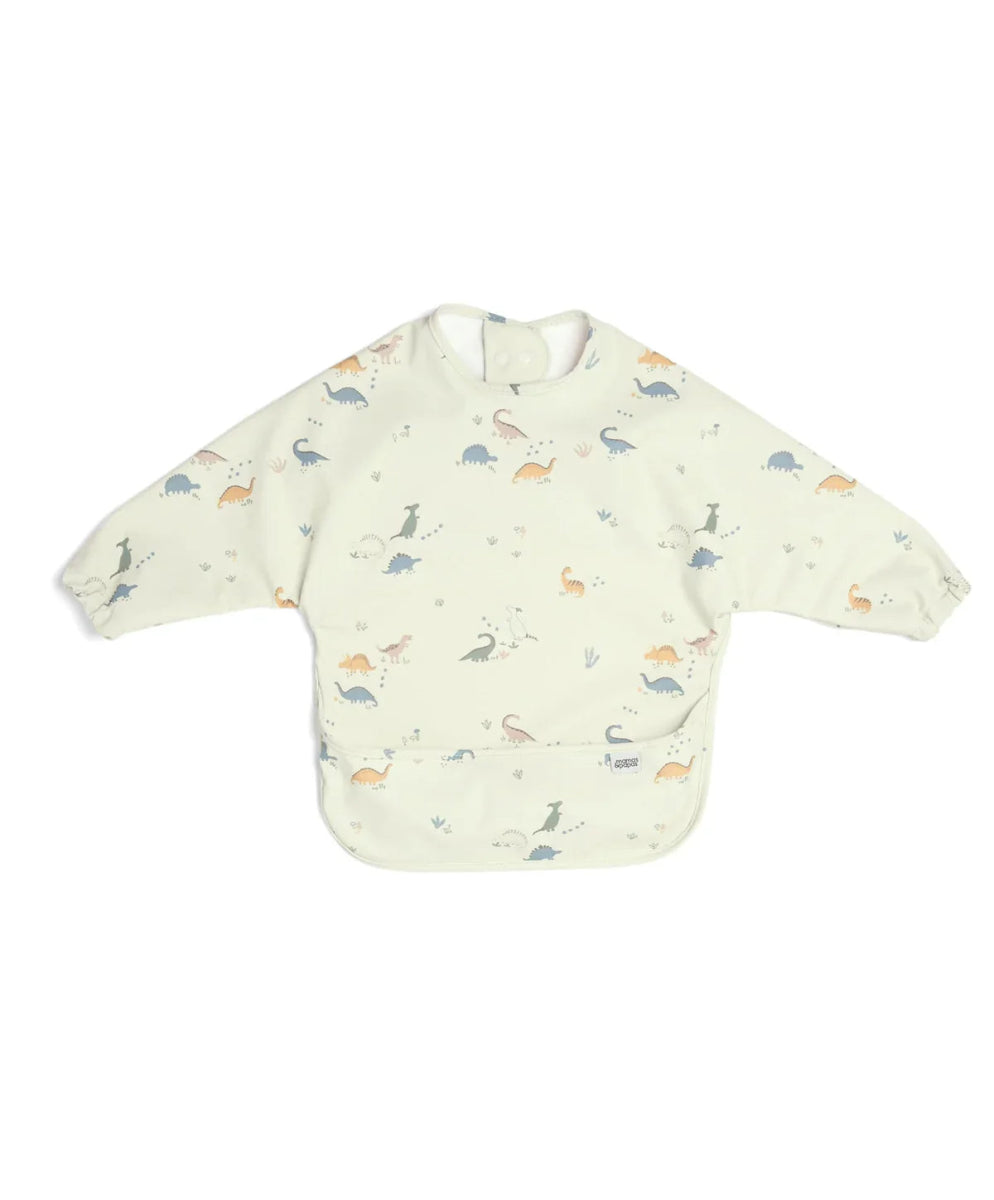 Long-sleeved bib top with light cream dinosaur print, snap neckline and bib front
