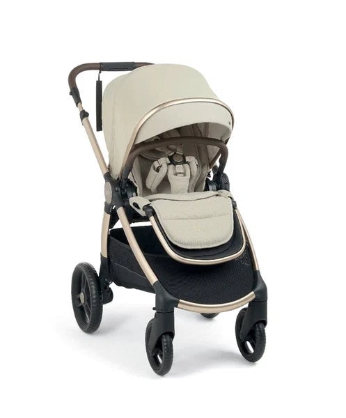 Cream pushchair with padded carrycot insert, round canopy, and front seat bumper bar