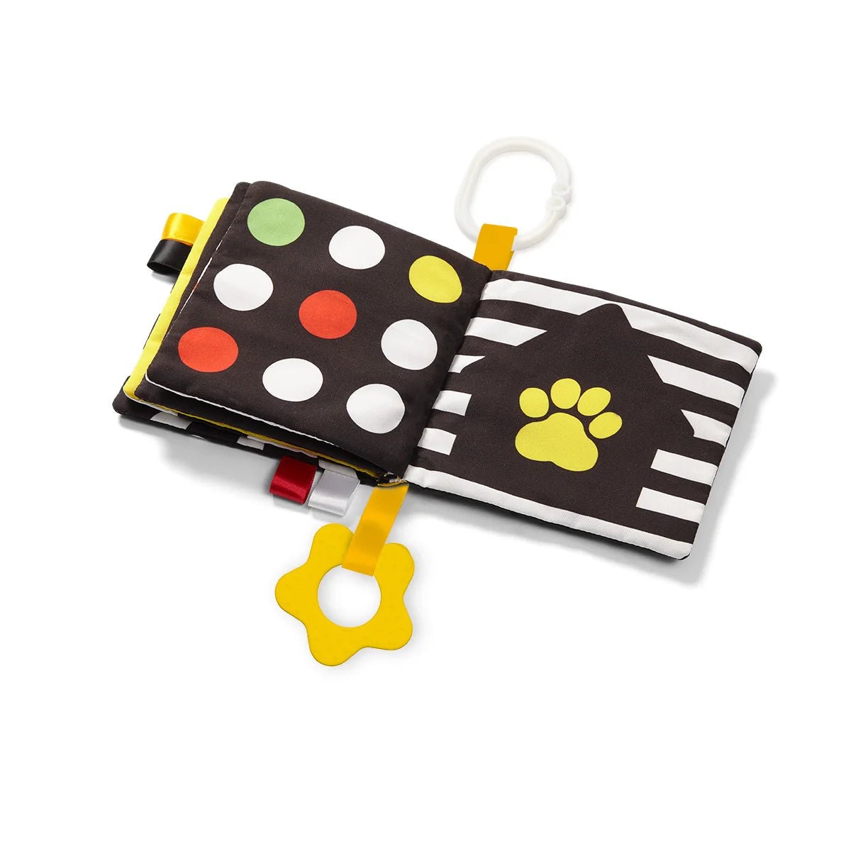 Sensory contrast book open to two panels: dot print and paw print with striped page