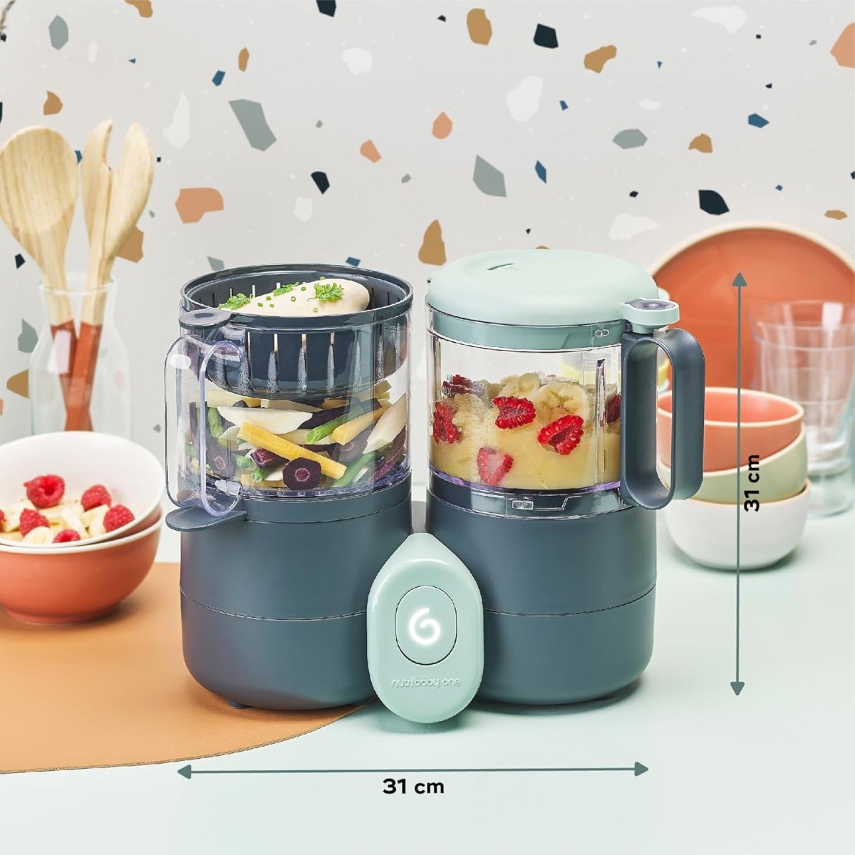 Baby food processor with two clear jars and mint lid; about 31 cm wide