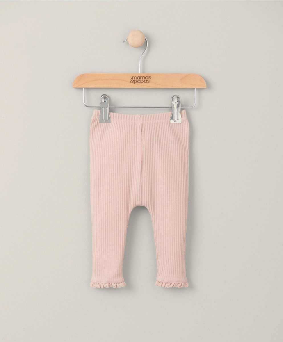 Pink ribbed leggings with ruffled cuffs