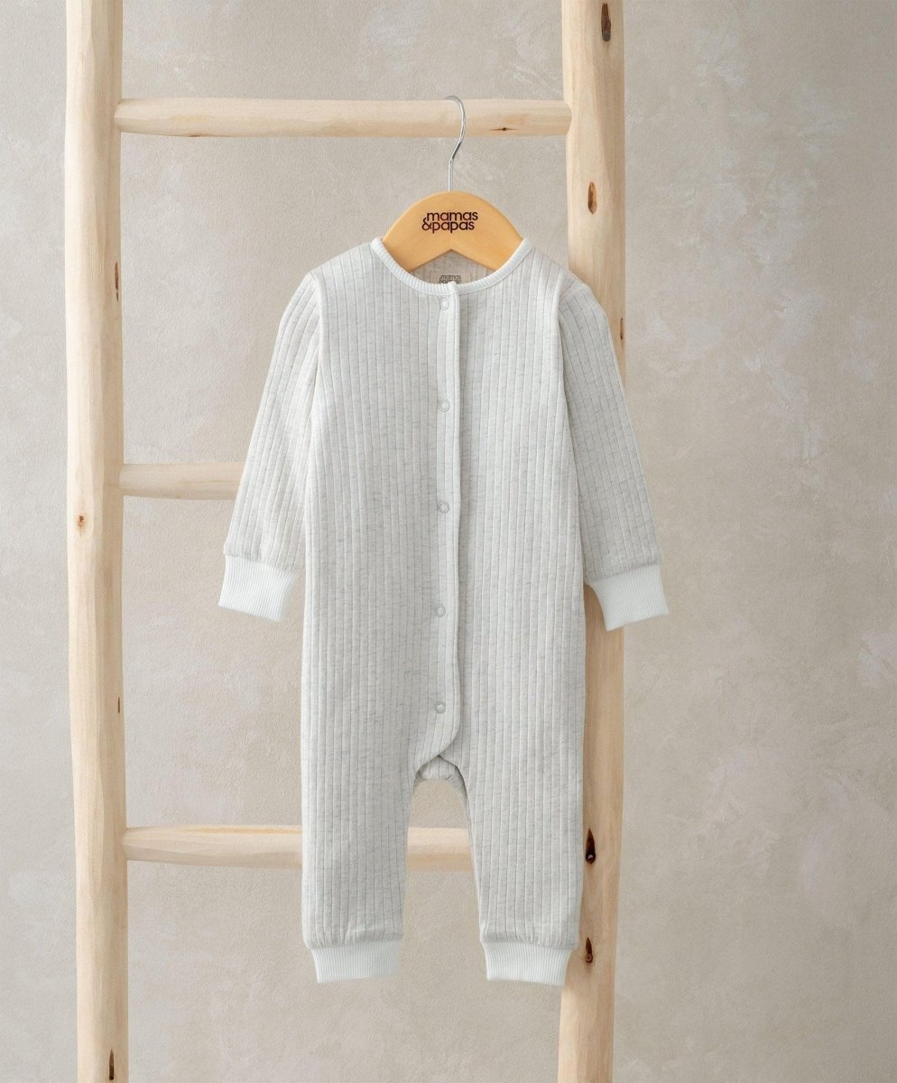 Ribbed long-sleeve romper in light grey with button front and footed legs