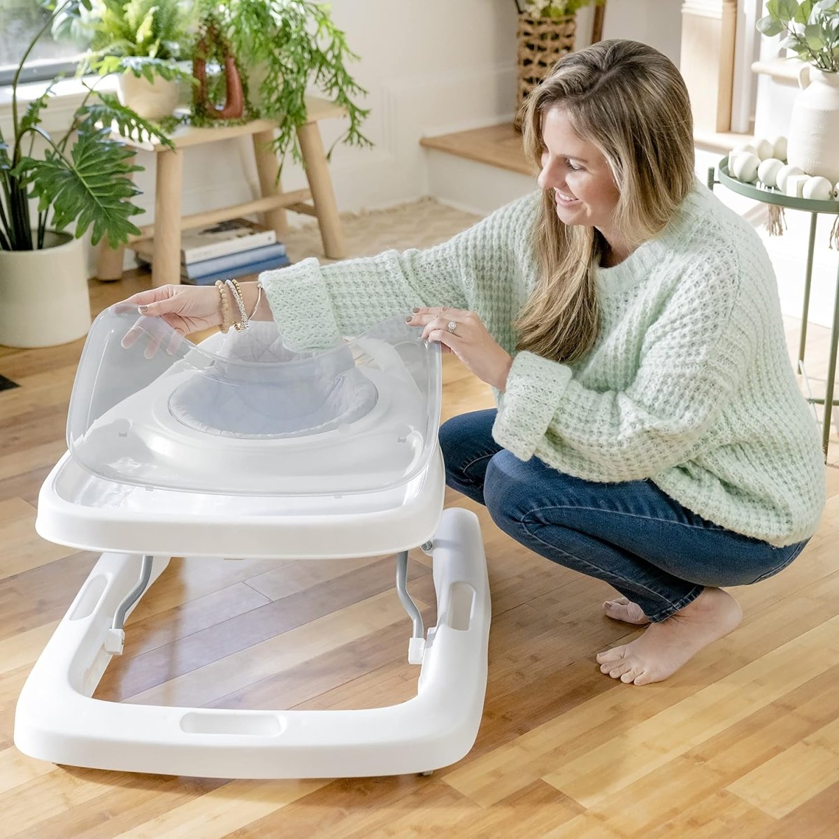 White 3-in-1 foldable baby activity walker with clear play tray and toys