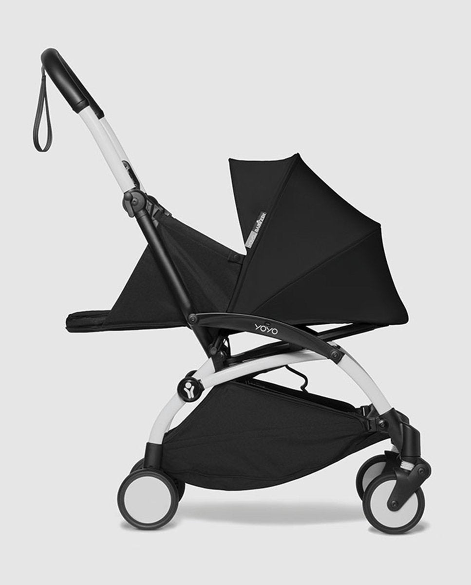 Black newborn stroller seat pack with canopy, side view and wheels