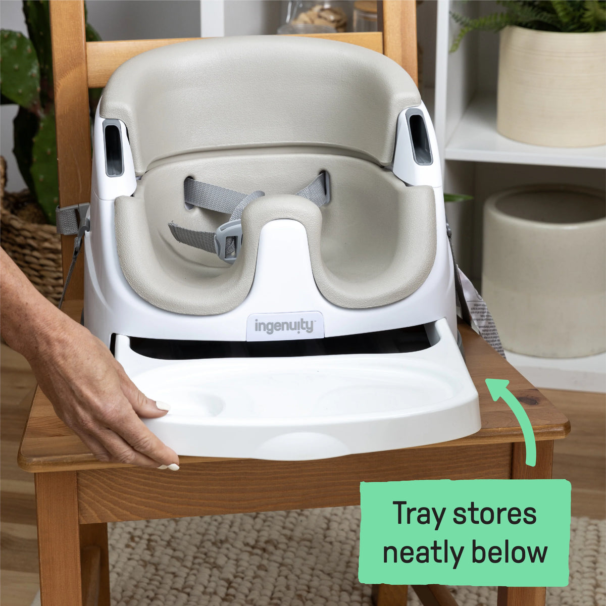 Baby booster feeding seat with light gray backrest and white tray, front view