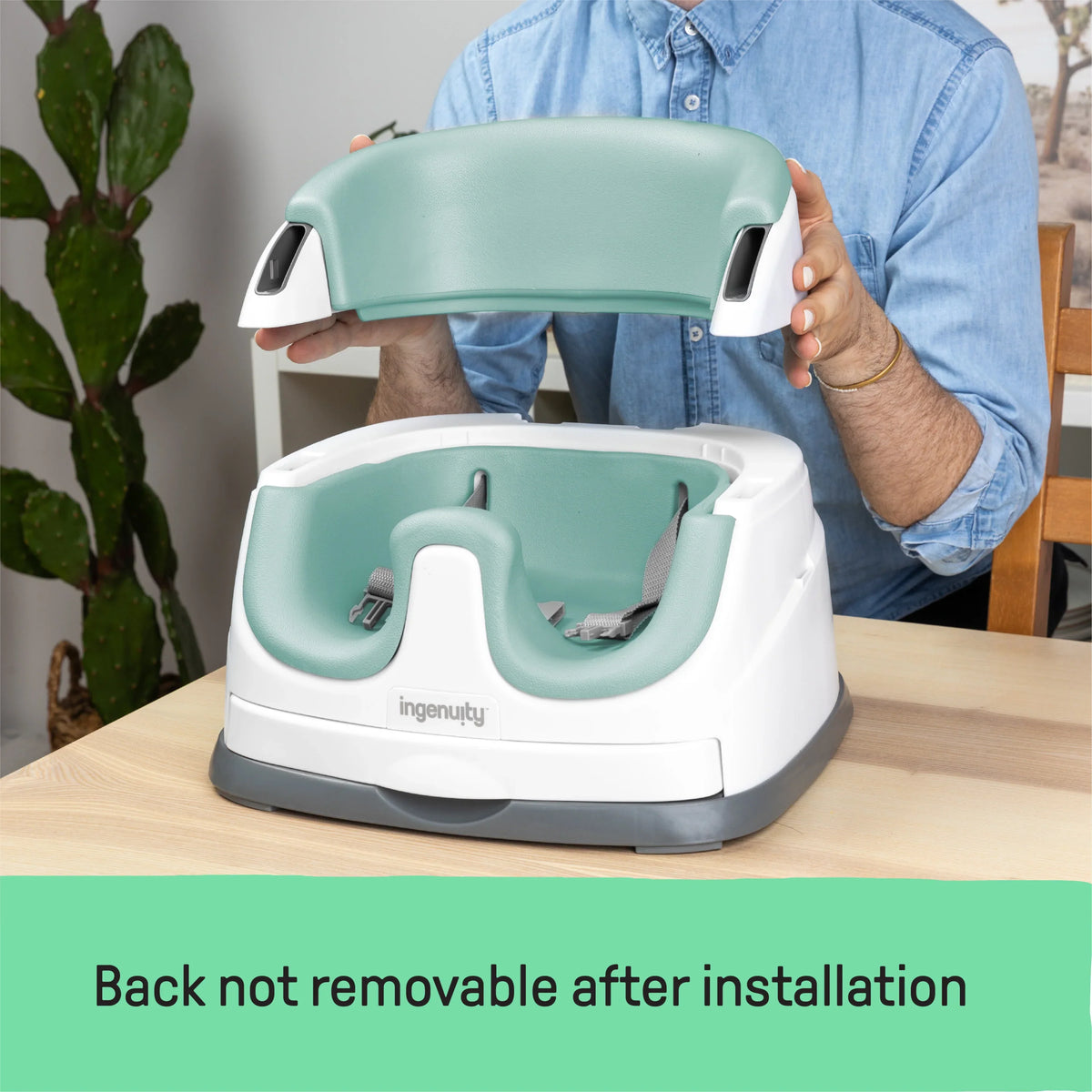 2-in-1 baby booster seat with white tray and mint green seat pad on base