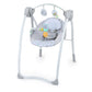 White baby swing with padded seat, hanging toy bar, reclined posture.