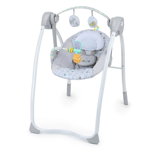 White baby swing with padded seat, hanging toy bar, reclined posture.
