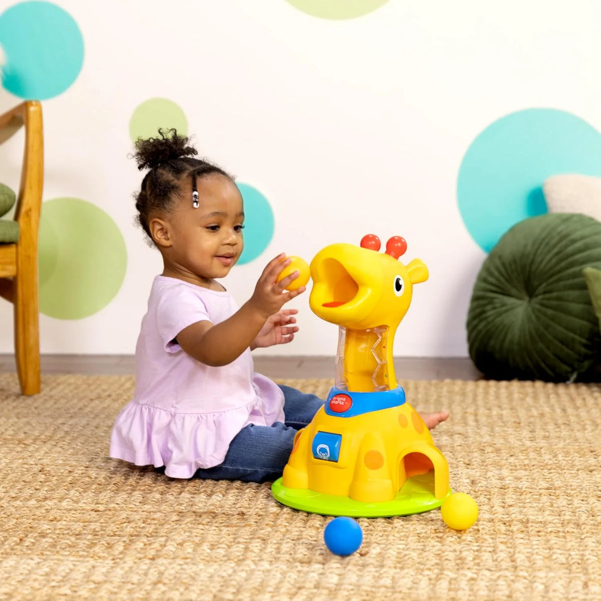 Yellow giraffe ball play toy with blue base and rainbow balls