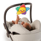 Plush star musical toy hanging from stroller bar, showing smiling yellow face