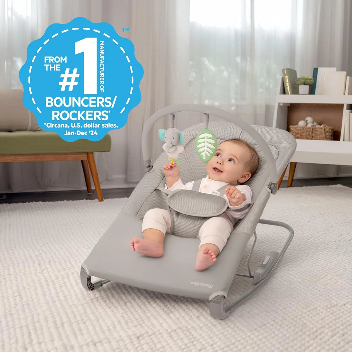 Grey infant rocker seat with reclined pad and hanging plush toy