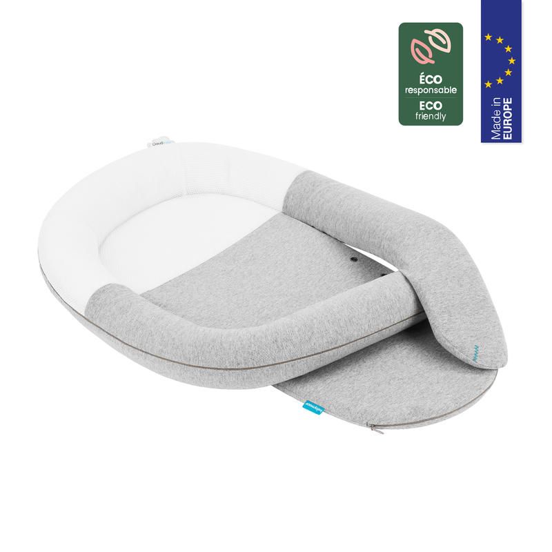 Anti-colic baby reducer pillow with curved gray and white design and detachable insert