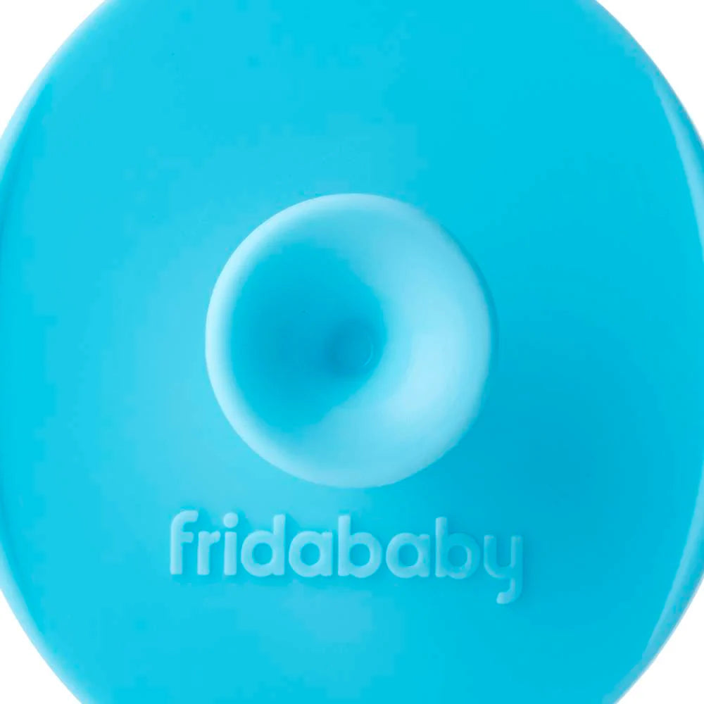 Teal silicone skin soother brush head with raised center detail and micro nubs