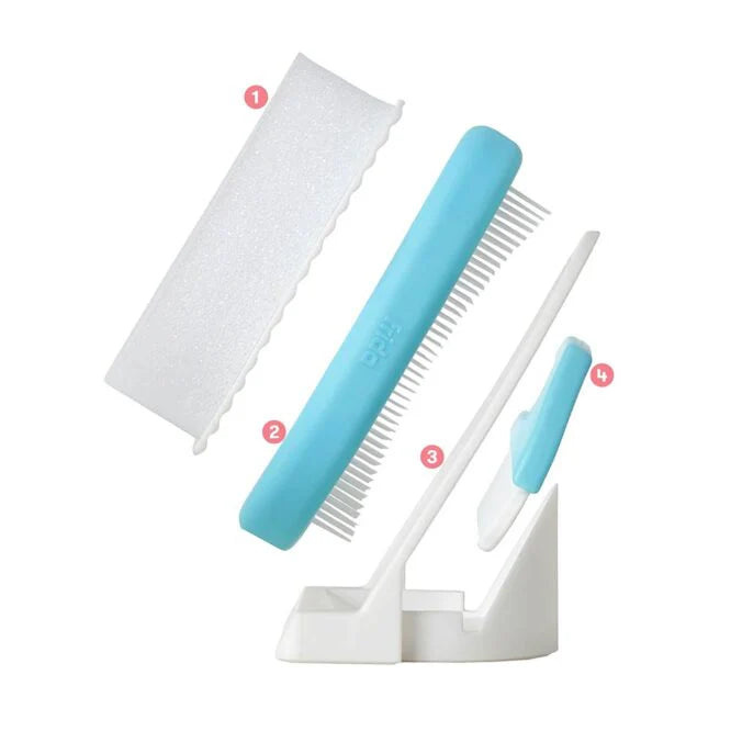 Cradle cap system attachments: teal brush, comb, and scalp brush on stand