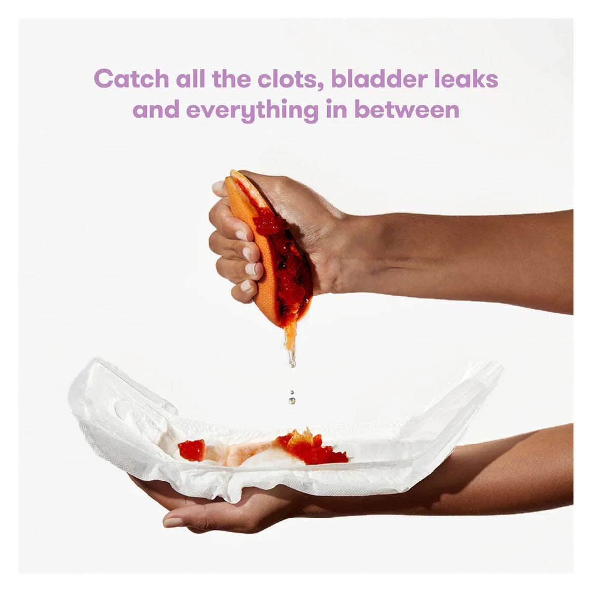 Postpartum absorbent pads being held in hands, folded pads visible
