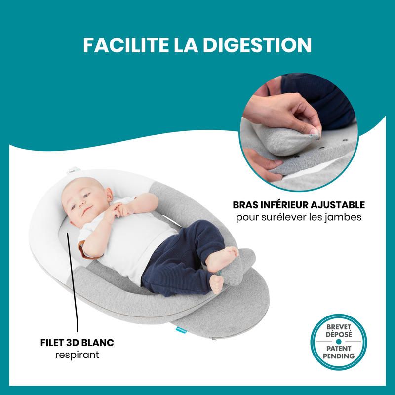 Anti-colic baby reducer with adjustable lower wedge supporting an infant, gray cover