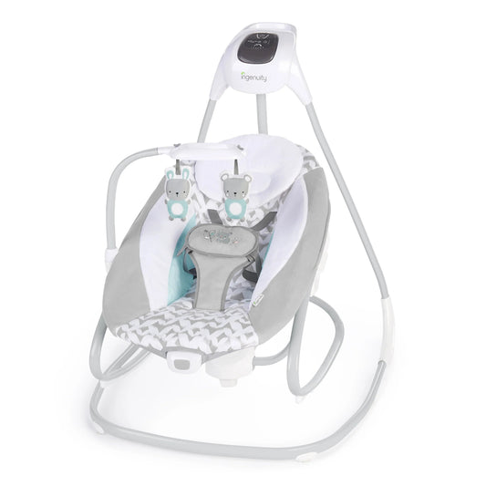 Baby swing and rocker with white frame, gray seat cushion, and patterned cover