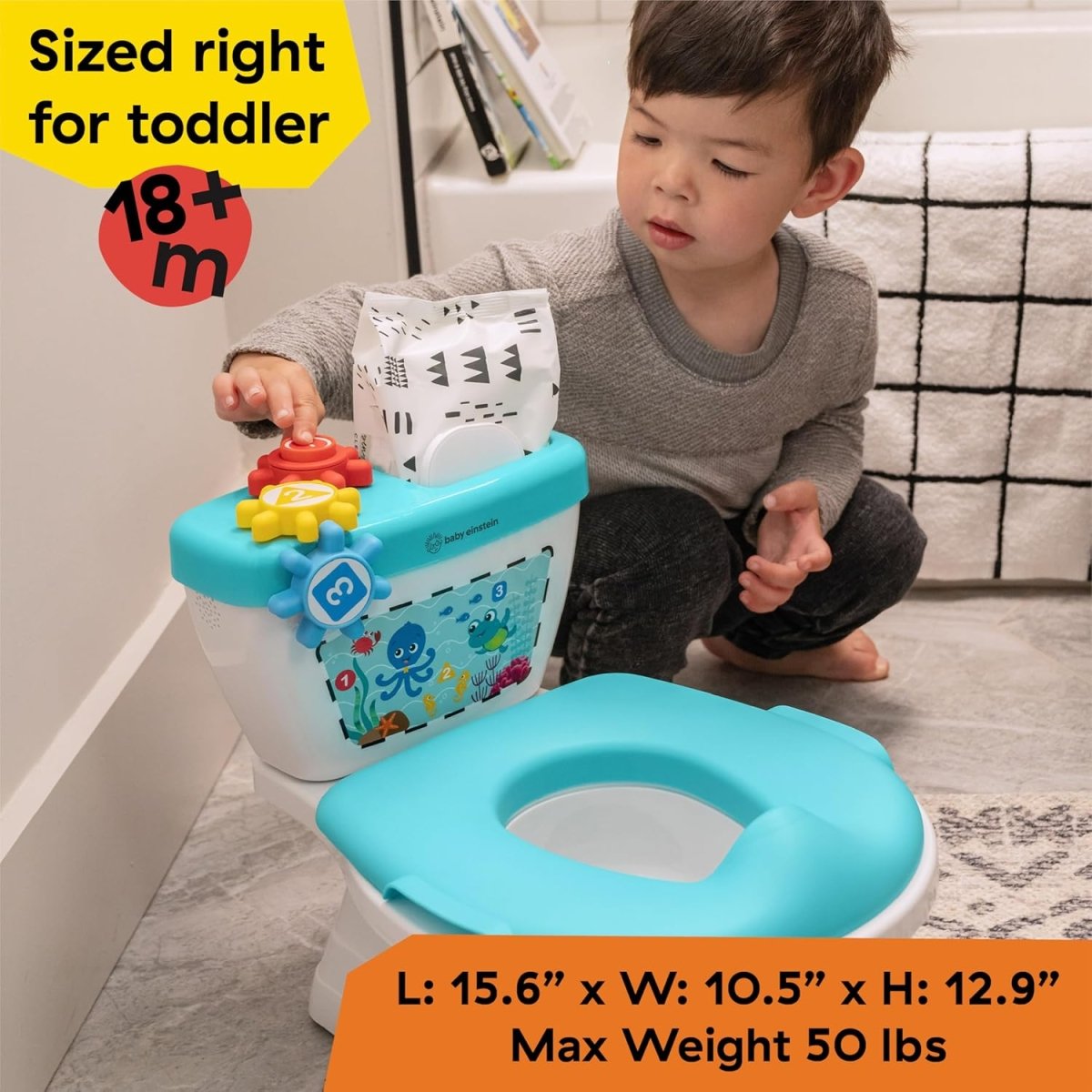 Teal potty training system for toddlers with white base and front toy activity panel