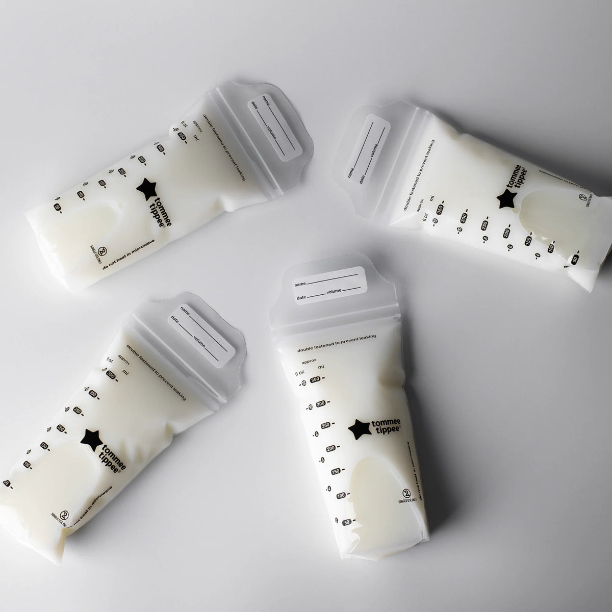 Breast milk storage bags in white pouches with measuring marks, six-pack arrangement