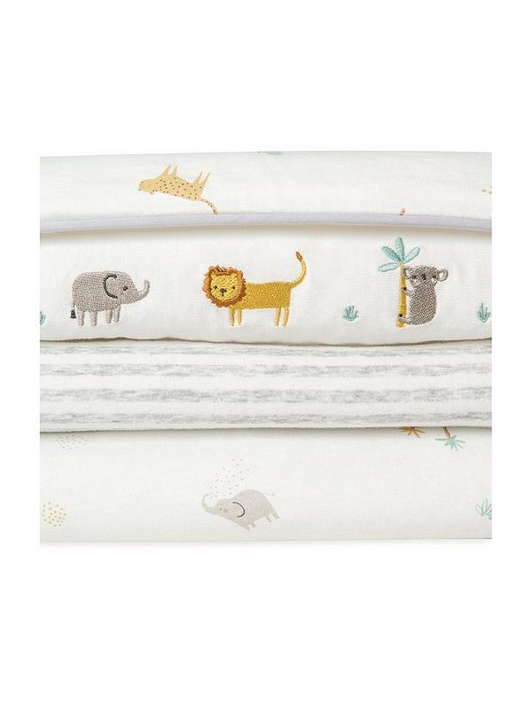 Nursery quilt fabric with scattered safari animals and subtle gray stripes