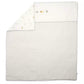 Nursery quilt with white and light gray striped panel and small animal print trim