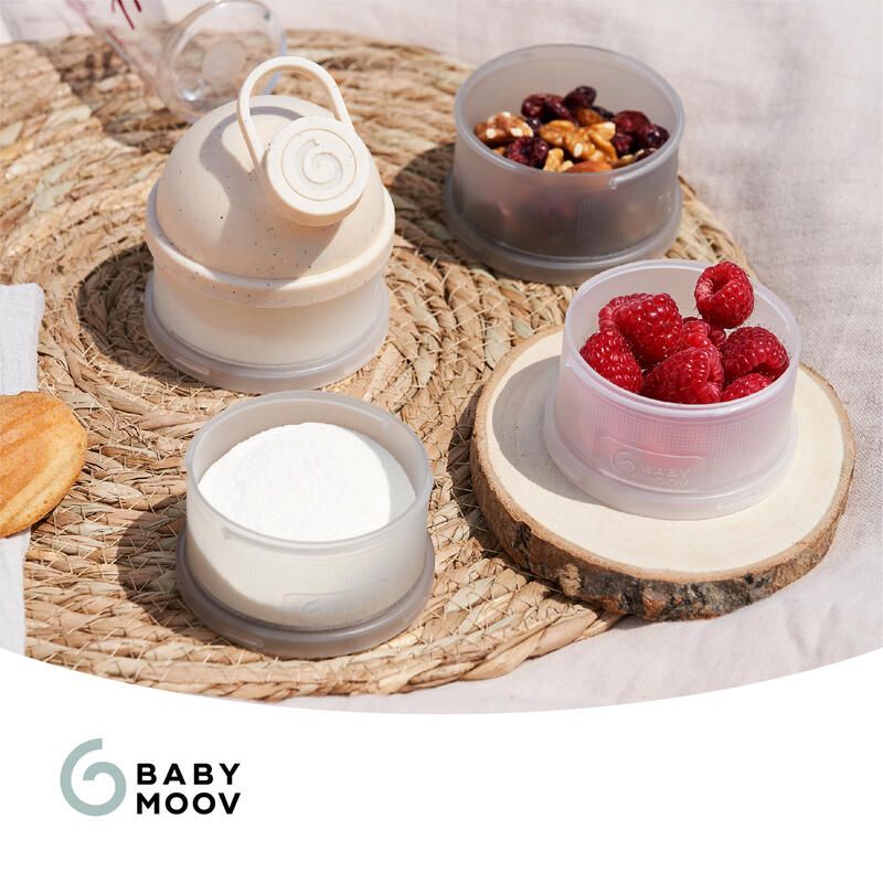 Baby Moov dosing container set with scoop, lid, and storage cups in light beige