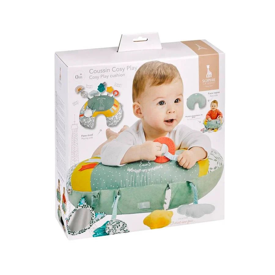 Cozy play cushion box shows green cushion with hanging toys and animal prints