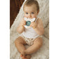 Gray giraffe magic mirror with circular reflective window, held by a baby