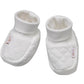 Pair of white newborn booties with quilted texture and fabric applique on sides
