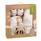Newborn outfit gift set with quilted blanket, bib, socks, and plush giraffe in box