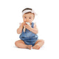 Baby holding white and blue silicone silhouette ring teething toy