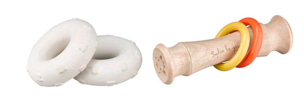 Totem rattle with white plush ring holders and red, yellow rings on wood handle