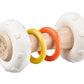 Totem rattle with white plush ends and multicolor plastic rings on light wood handle