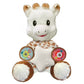 White plush animal toy with leopard-print bib and star-shaped belly with musical paw buttons