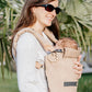Newborn baby carrier reducer, beige/cream front insert attached to carrier