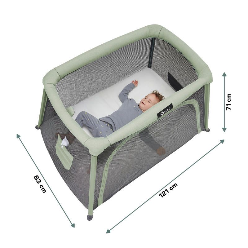 Travel cot with light green rails and gray fabric, baby lying inside