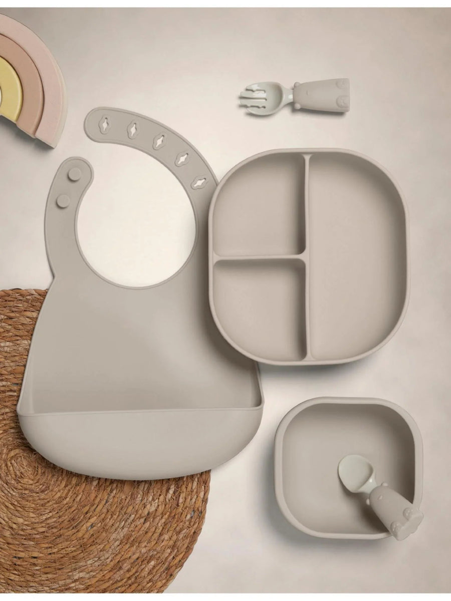 Baby weaning feeding set in light gray: bib, divided plate, small bowl, spoon