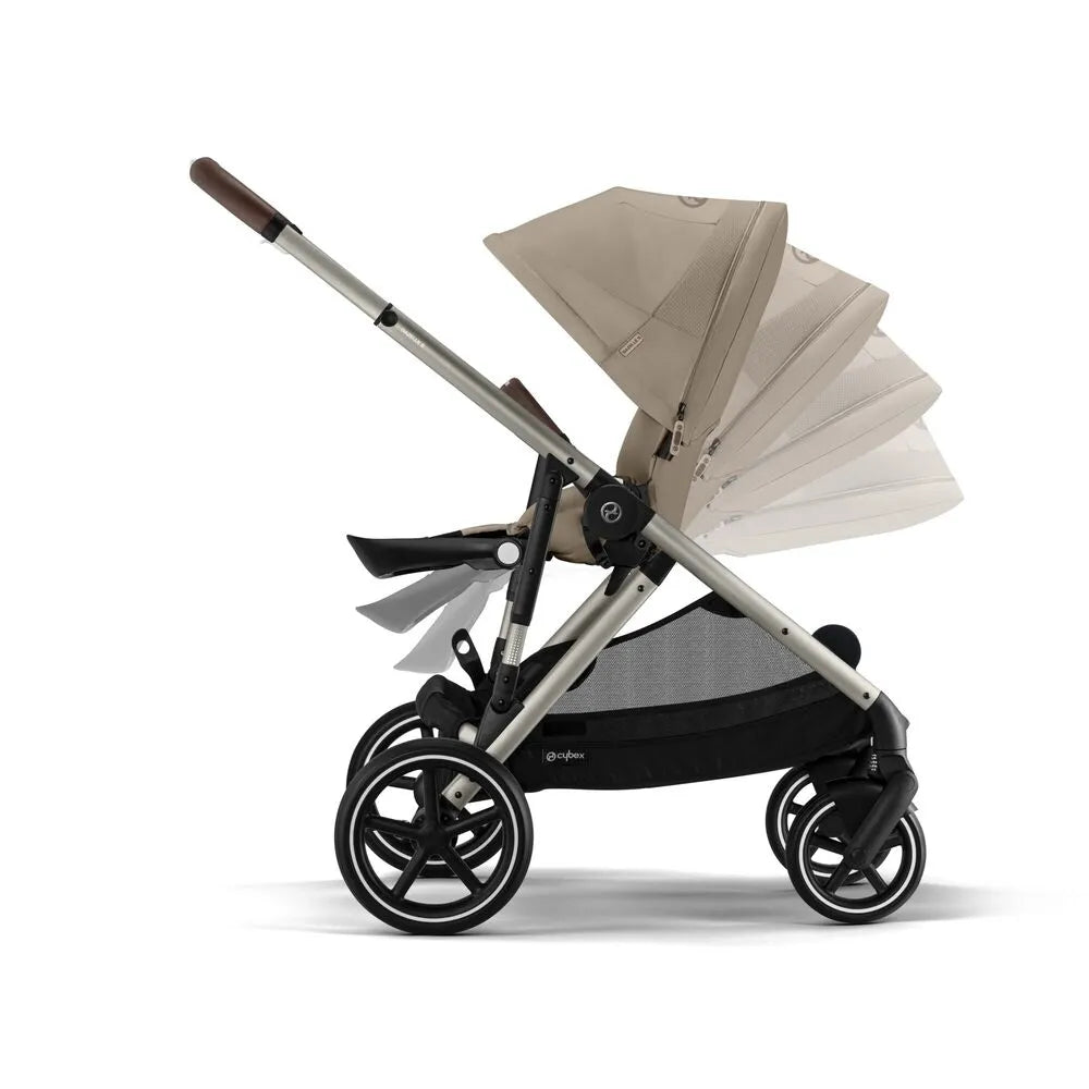 Almond beige stroller with large multi-panel canopy, dark frame and black wheels