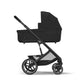 Black stroller in profile with canopy and large front and rear wheels